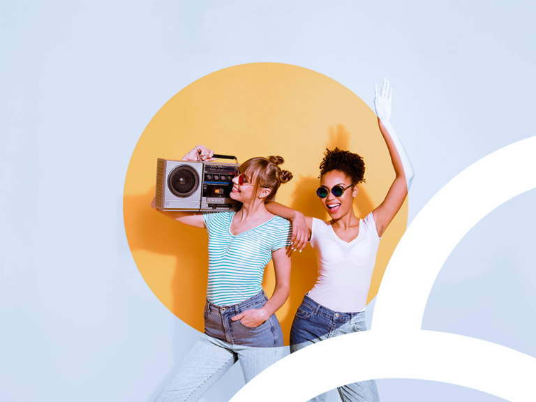 MCI brand identity visual, depicting a colourful spotlight on two happy women, with the brand graphic identifier, created by Magic Pencil