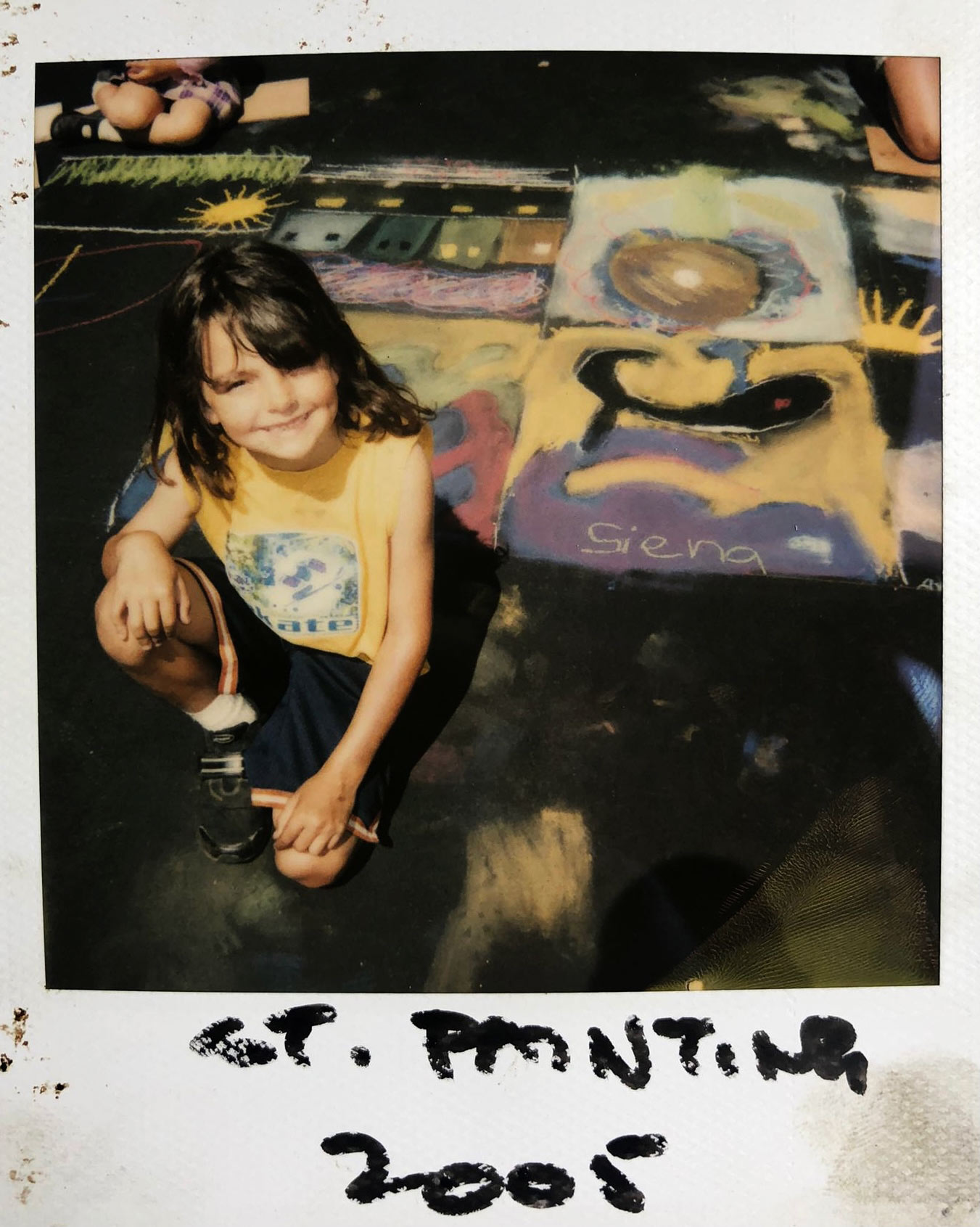 polaroid of siena and her chalk drawing in 2005